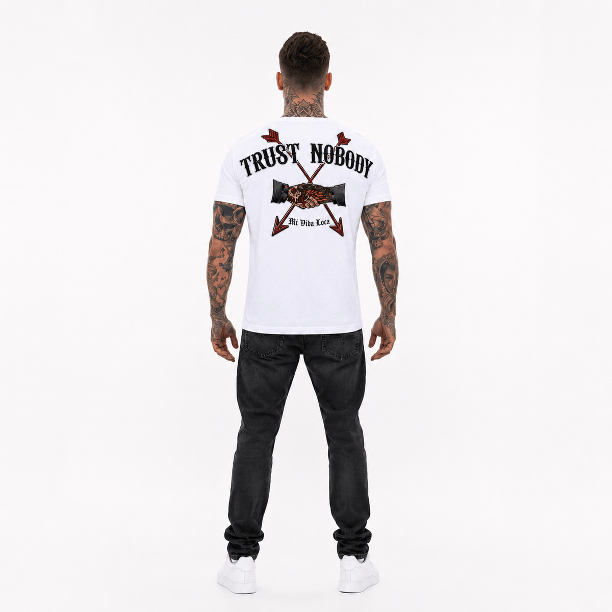 Trust nobody embroidery T-shirt in white worn by model, full back view with back print, head to toe