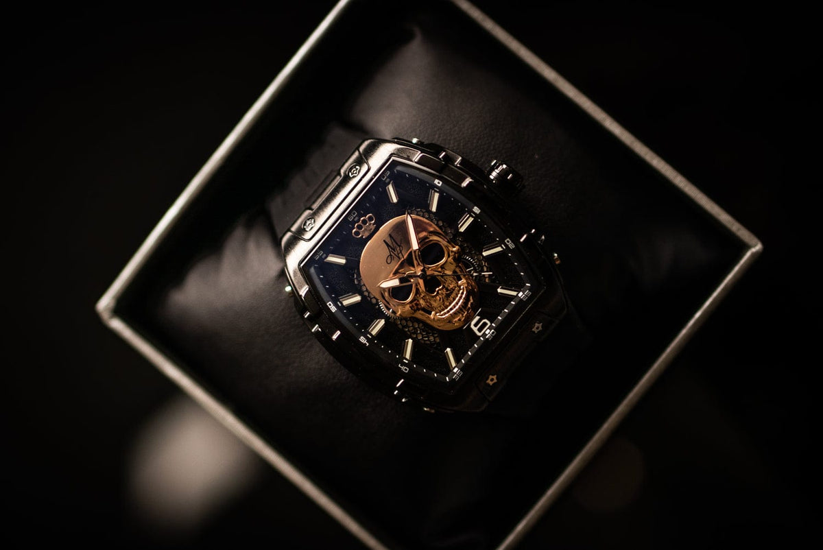 MVL Automatic Skull Watch in black on a cushion in the box, detail of the skull dial