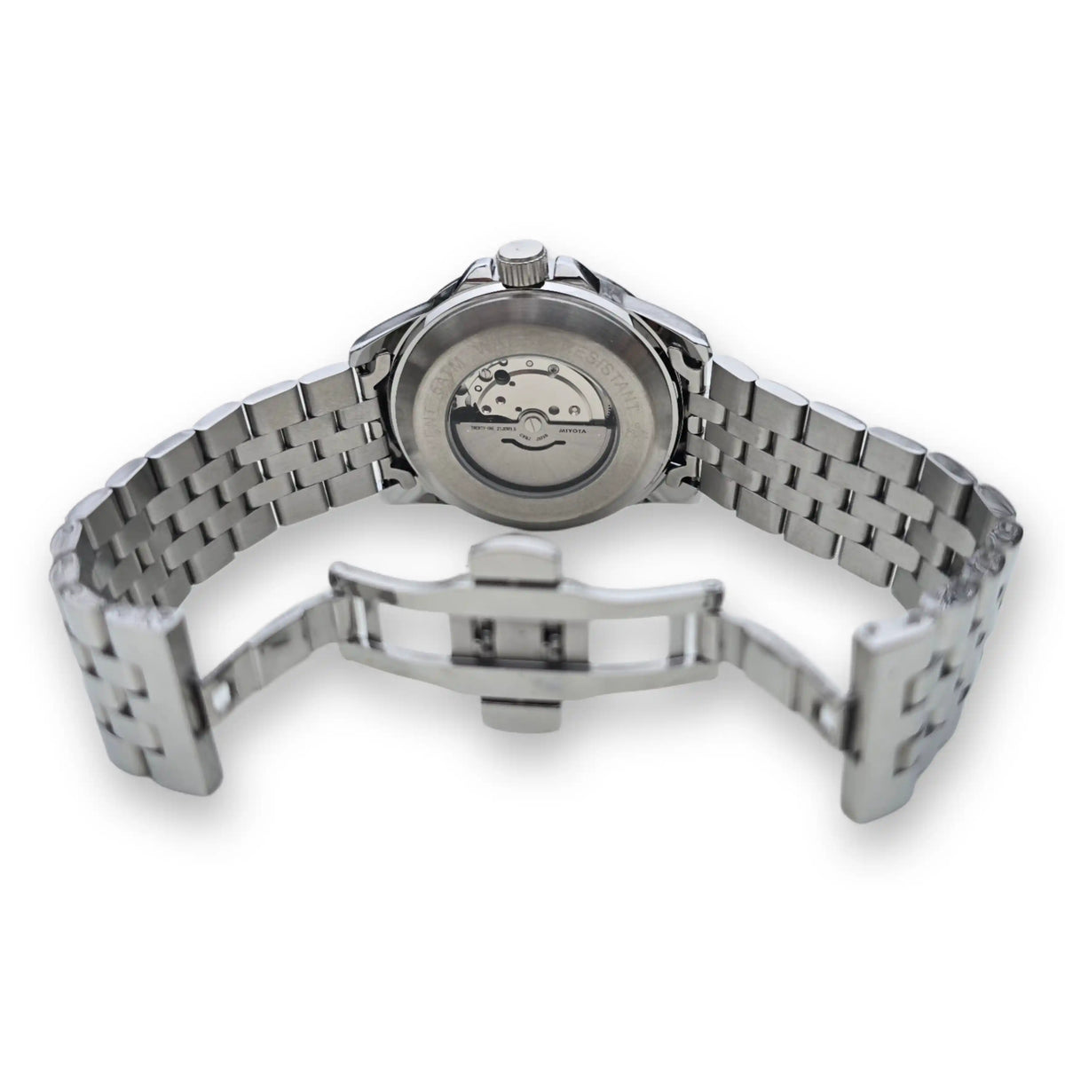 Parte trasera del reloj MVL AK47 plateado con mecanismo automático visible y cierre desplegable